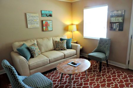 Bright living room with elegant furniture and modern decor, perfect for relaxation.